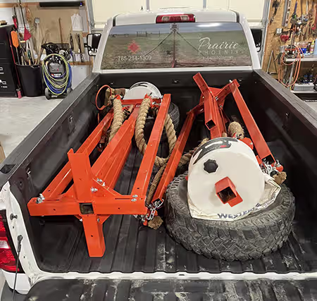 Two oilers fit comfortably in the back of a pickup truck